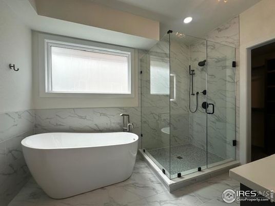 Bathroom, Free Standing Baths, Glass Shower, Interior, Marble, Marble Walls, Recessed Lighting