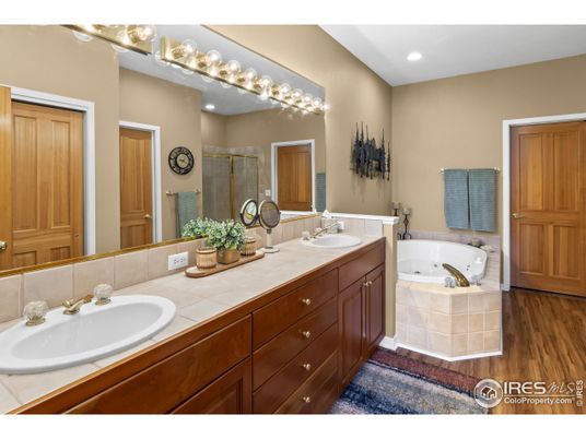 Bathroom, Dual Sink Vanities, Interior, Recessed Lighting, Tile Countertops, Wood Texture Flooring
