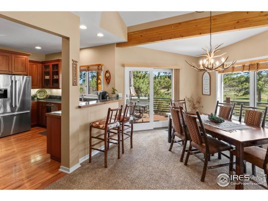 Chandelier, Dining room, Interior, Kitchen, Pendant Lights, Recessed Lighting, Stainless Steel Appliances, Wooden Beams, Wood Texture Flooring