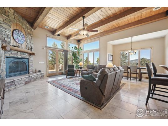 Chandelier, Dining room, Fireplace, Interior, Living room, Pendant Lights, Stone Walls, Wooden Beams, Wooden Ceilings