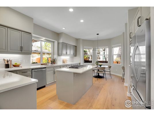 Dining room, Interior, Kitchen, Pendant Lights, Recessed Lighting, Stainless Steel Appliances, Wood Texture Flooring