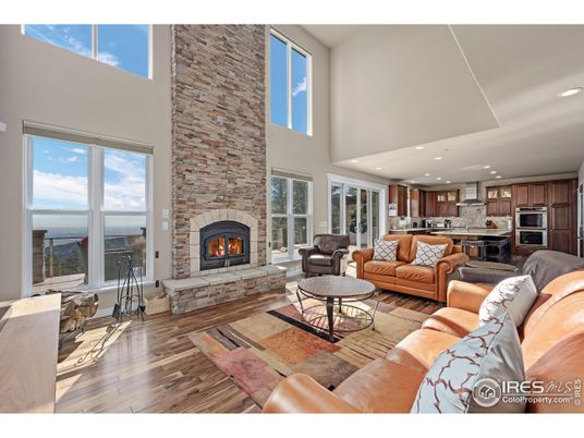 Fireplace, Interior, Kitchen, Living room, Recessed Lighting, Stainless Steel Appliances, Stone Walls, Wood Texture Flooring