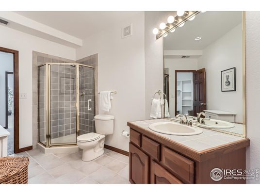 Bathroom, Dual Sink Vanities, Glass Shower, Interior, Recessed Lighting, Tile Countertops
