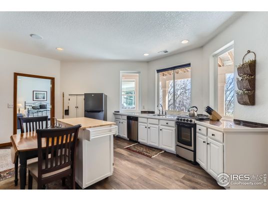 Dining room, Interior, Kitchen, Recessed Lighting, Stainless Steel Appliances, Wood Texture Flooring