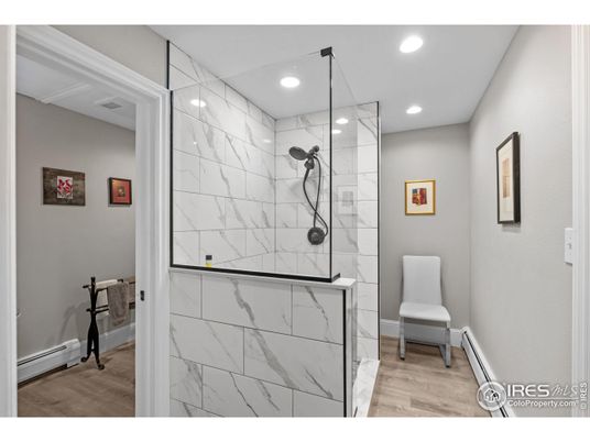 Bathroom, Glass Shower, Interior, Marble Walls, Recessed Lighting, Wood Texture Flooring