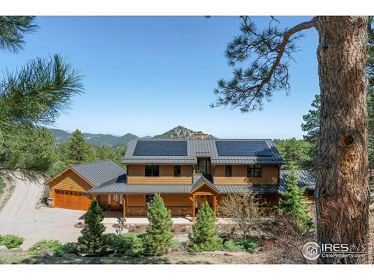 Exterior, Facade, Solar Panels, Log Home