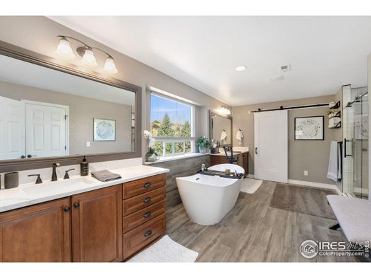 Bathroom, Dual Sink Vanities, Free Standing Baths, Glass Shower, Interior, Recessed Lighting, Wood Texture Flooring