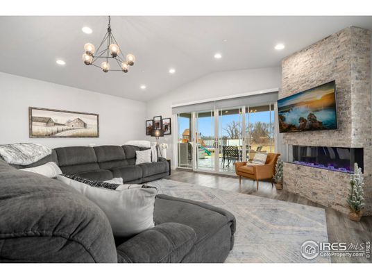 Fireplace, Interior, Living room, Pendant Lights, Recessed Lighting, Stone Walls, Wood Texture Flooring