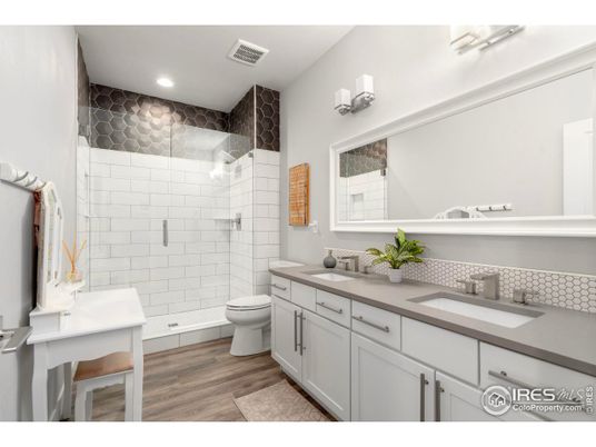 Bathroom, Dual Sink Vanities, Glass Shower, Interior, Recessed Lighting, Wood Texture Flooring