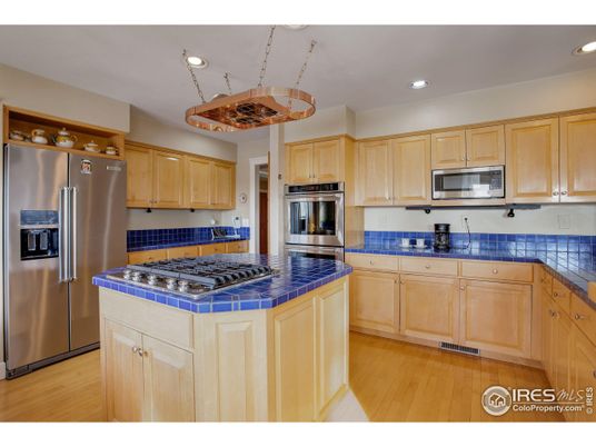 Interior, Kitchen, Recessed Lighting, Stainless Steel Appliances, Tile Countertops, Wood Texture Flooring