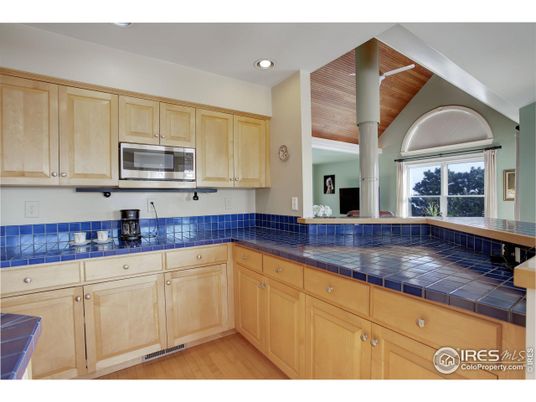 Interior, Kitchen, Recessed Lighting, Tile Countertops, Wood Texture Flooring