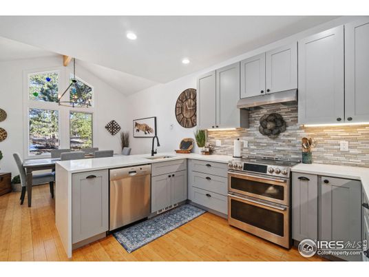 Dining room, Interior, Kitchen, Recessed Lighting, Stainless Steel Appliances, Wood Texture Flooring