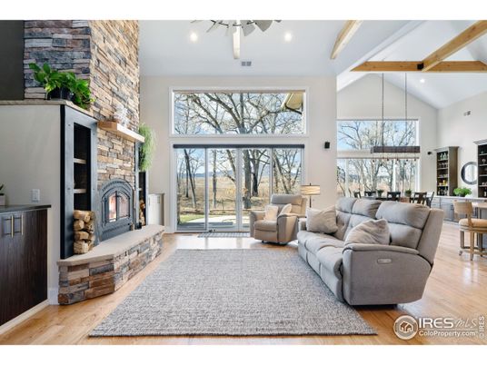 Dining room, Fireplace, Interior, Living room, Recessed Lighting, Stone Walls, Wooden Beams, Wood Texture Flooring