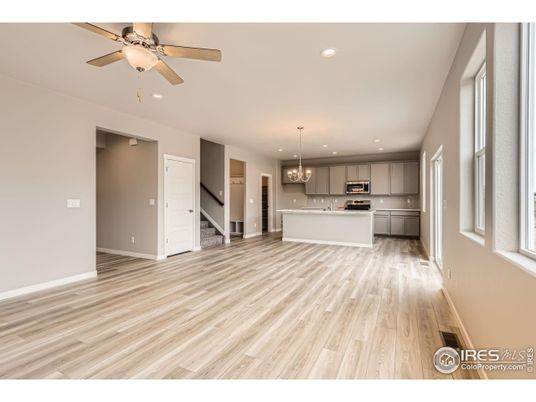 Chandelier, Empty room, Interior, Kitchen, Pendant Lights, Recessed Lighting, Stainless Steel Appliances, Wood Texture Flooring