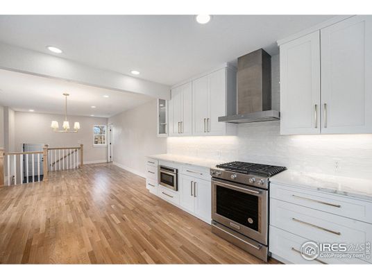 Chandelier, Interior, Kitchen, Pendant Lights, Recessed Lighting, Stainless Steel Appliances, Wood Texture Flooring