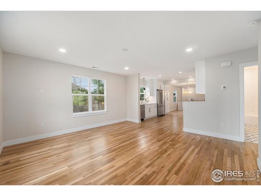Empty room, Interior, Kitchen, Recessed Lighting, Stainless Steel Appliances, Wood Texture Flooring