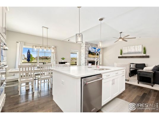 Dining room, Fireplace, Interior, Kitchen, Pendant Lights, Stainless Steel Appliances, Wood Texture Flooring