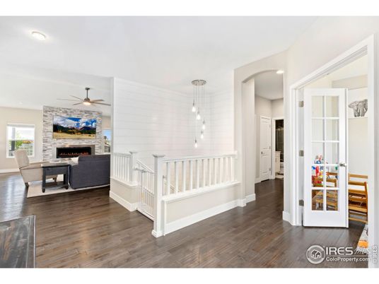 Fireplace, Interior, Living room, Pendant Lights, Recessed Lighting, Stone Walls, Wood Texture Flooring