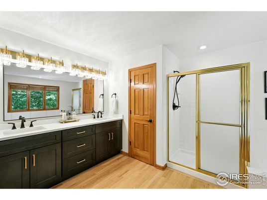Bathroom, Dual Sink Vanities, Glass Shower, Interior, Recessed Lighting, Wood Texture Flooring