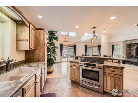 Chandelier, Interior, Kitchen, Pendant Lights, Recessed Lighting, Stainless Steel Appliances, Wood Texture Flooring