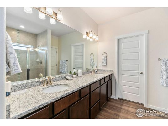 Bathroom, Dual Sink Vanities, Glass Shower, Interior, Recessed Lighting, Wood Texture Flooring