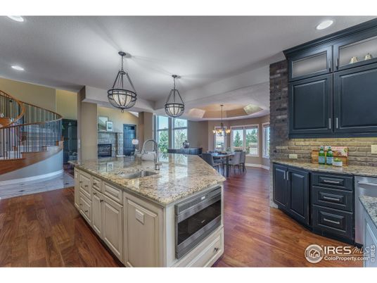 Chandelier, Dining room, Interior, Kitchen, Pendant Lights, Recessed Lighting, Stainless Steel Appliances, Wood Texture Flooring