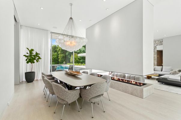 Chandelier, Dining room, Fireplace, Interior, Living room, Pendant Lights, Recessed Lighting, Wood Texture Flooring