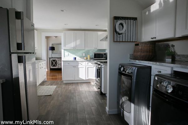 Interior, Kitchen, Recessed Lighting, Washer, Wood Texture Flooring