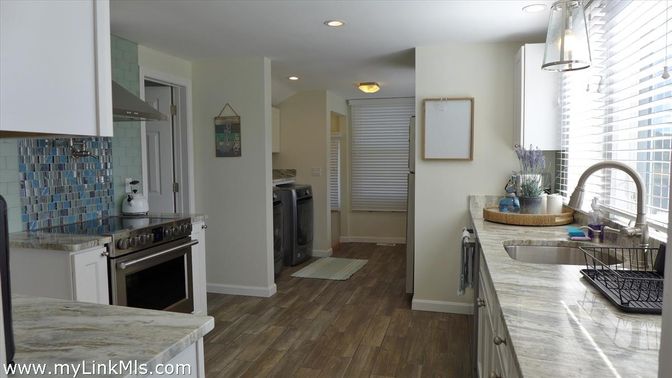 Interior, Kitchen, Recessed Lighting, Washer, Wood Texture Flooring