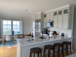 Dining room, Interior, Kitchen, Recessed Lighting, Stainless Steel Appliances, Wood Texture Flooring