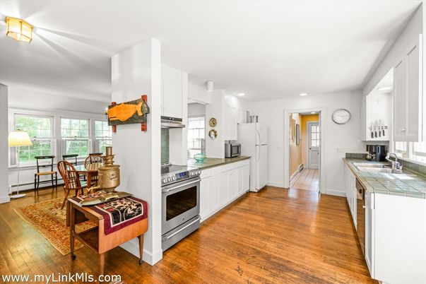 Dining room, Interior, Kitchen, Recessed Lighting, Stainless Steel Appliances, Tile Countertops, Wood Texture Flooring
