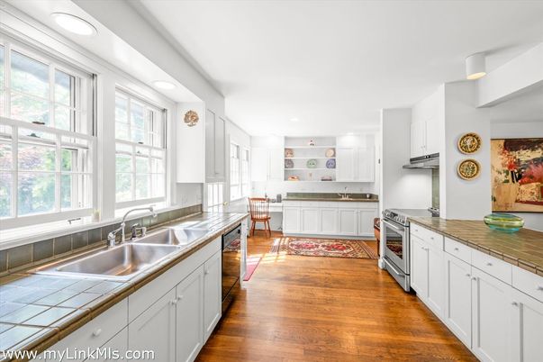 Interior, Kitchen, Recessed Lighting, Stainless Steel Appliances, Tile Countertops, Wood Texture Flooring