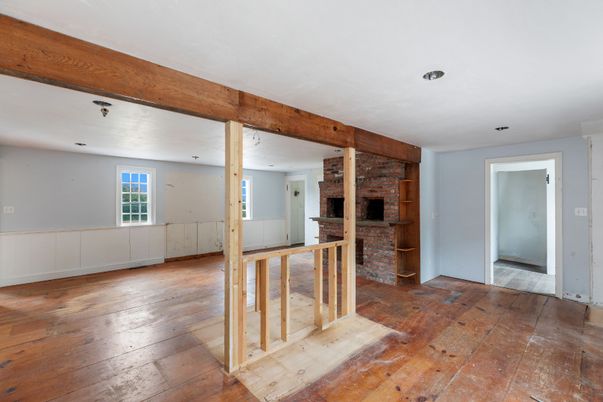 Empty room, Fireplace, Interior, Recessed Lighting, Stone Walls, Wooden Beams, Wood Texture Flooring