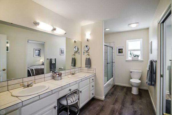 Bathroom, Dual Sink Vanities, Interior, Recessed Lighting, Tile Countertops, Wood Texture Flooring