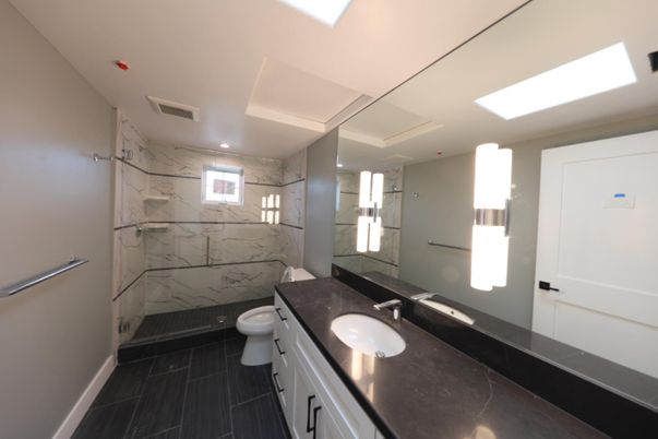 Bathroom, Dual Sink Vanities, Glass Shower, Interior, Marble, Marble Walls, Recessed Lighting