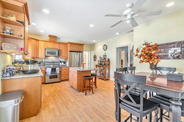 Dining room, Interior, Kitchen, Recessed Lighting, Stainless Steel Appliances, Wood Texture Flooring
