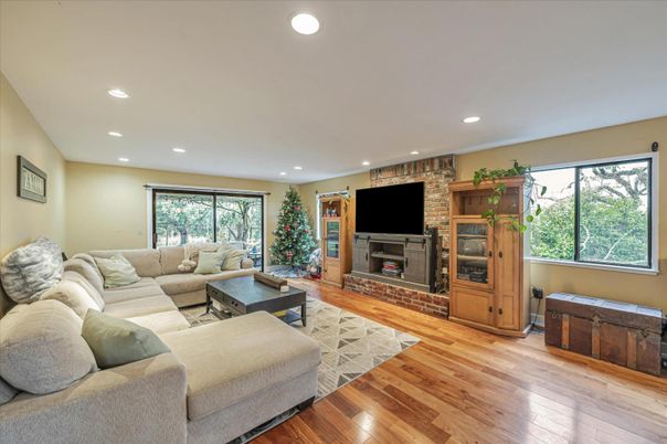Fireplace, Interior, Living room, Recessed Lighting, Stone Walls, Wood Texture Flooring