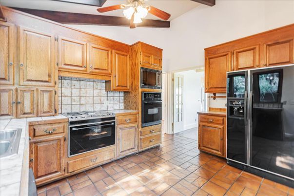 Interior, Kitchen, Tile Countertops, Wooden Beams