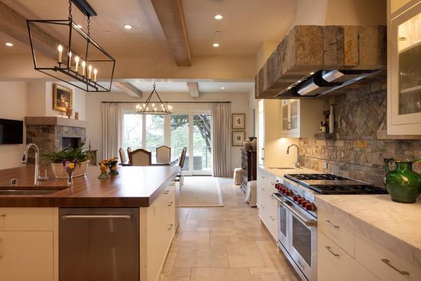 Chandelier, Dining room, Fireplace, Interior, Kitchen, Living room, Pendant Lights, Recessed Lighting, Stainless Steel Appliances, Stone Walls, Wooden Beams