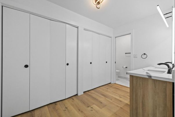 Bathroom, Dual Sink Vanities, Glass Shower, Interior, Marble, Marble Walls, Recessed Lighting