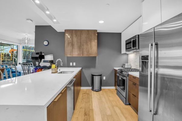 Chandelier, Dining room, Interior, Kitchen, Recessed Lighting, Stainless Steel Appliances, Wood Texture Flooring