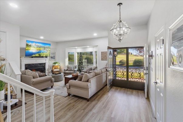 Chandelier, Fireplace, Interior, Living room, Pendant Lights, Recessed Lighting, Wood Texture Flooring