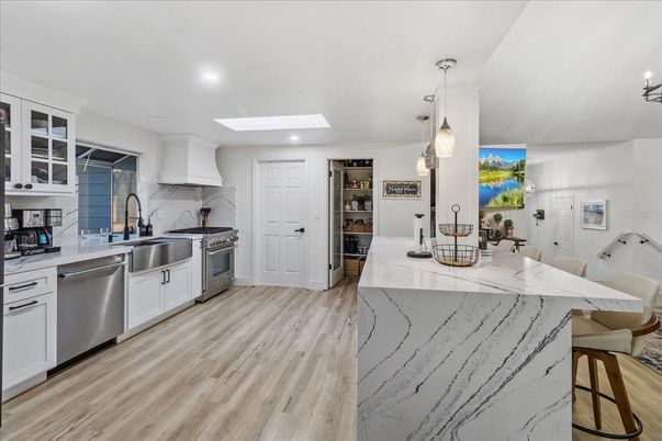 Dining room, Interior, Kitchen, Pendant Lights, Recessed Lighting, Stainless Steel Appliances, Wood Texture Flooring