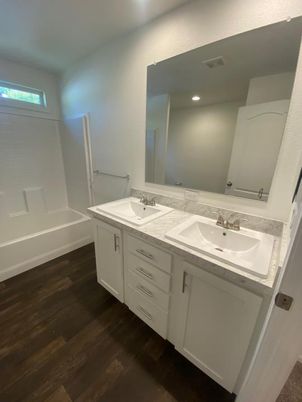 Bathroom, Dual Sink Vanities, Interior, Recessed Lighting, Wood Texture Flooring