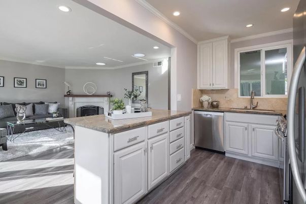 Fireplace, Interior, Kitchen, Living room, Recessed Lighting, Stainless Steel Appliances, Wood Texture Flooring