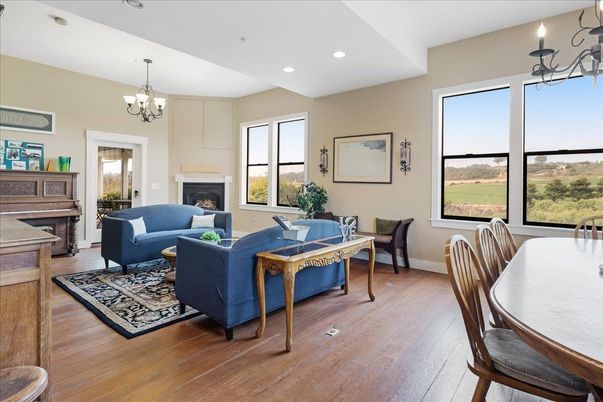 Chandelier, Dining room, Fireplace, Interior, Living room, Piano, Recessed Lighting, Wood Texture Flooring