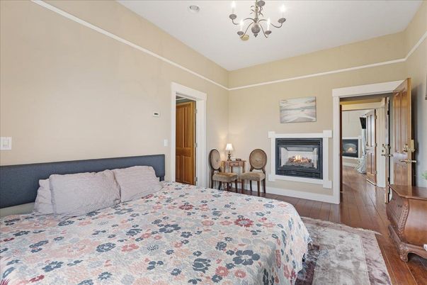 Bedroom, Chandelier, Fireplace, Interior, Wood Texture Flooring