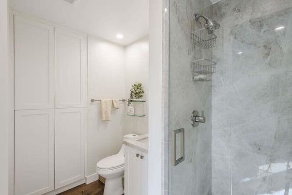 Bathroom, Glass Shower, Interior, Marble Walls, Recessed Lighting, Wood Texture Flooring