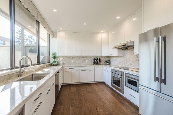 Interior, Kitchen, Marble Walls, Recessed Lighting, Stainless Steel Appliances, Wood Texture Flooring