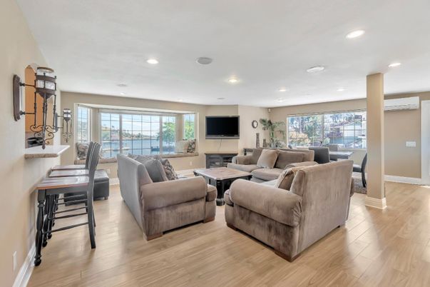 Dining room, Fireplace, Interior, Living room, Recessed Lighting, Wood Texture Flooring